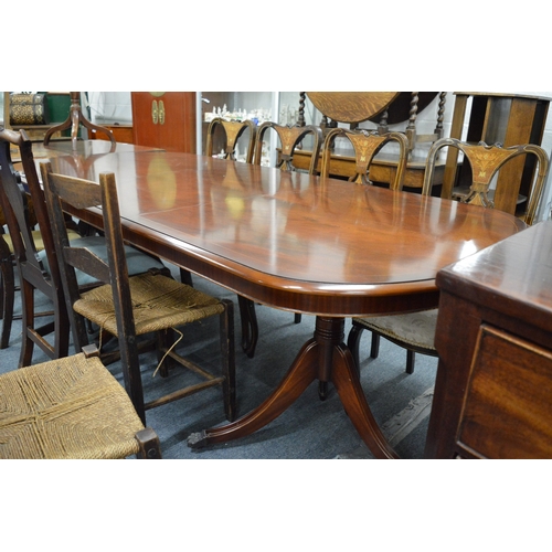 244 - A good reproduction mahogany twin pedestal dining table with one leaf.