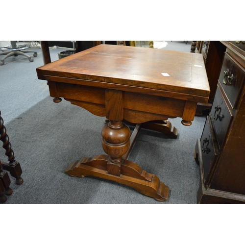 255 - An unusual miniature oak drawer leaf dining table.