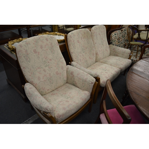 268 - A modern light elm Ercol two seater settee and matching armchair.