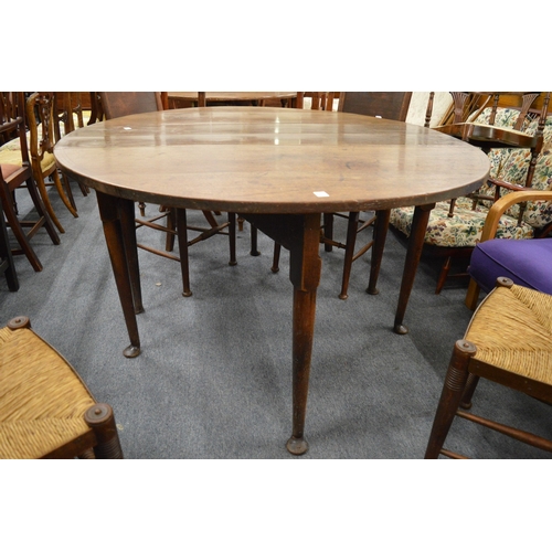 272 - An old oak drop leaf gateleg dining table with a drawer to each end.