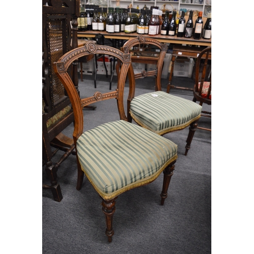 285 - A pair of Victorian walnut dining chairs.