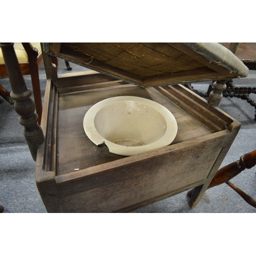 290 - A 19th century mahogany commode chair.