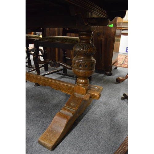 300 - A good oak refectory style drawer leaf dining table.