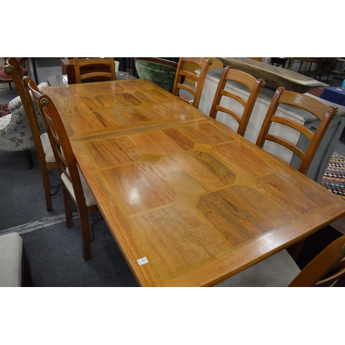 307 - A good modern rectangular extending dining table with one leaf together with a set of eight matching... 