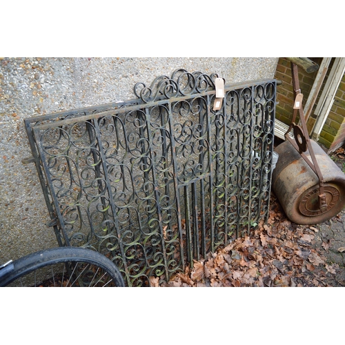 31 - A pair of wrought iron driveway gates, each measuring 135cm wide x 104cm high.