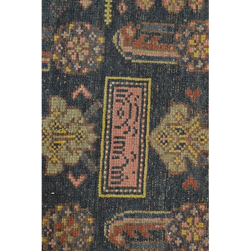 332 - Early Persian runner, blue ground with stylised decoration, signed, 406cm x 112cm.