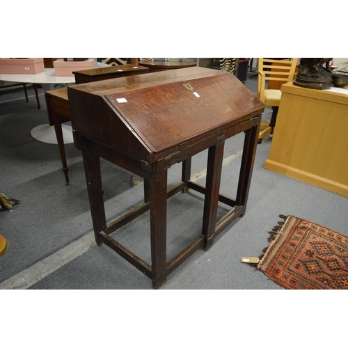 348 - An 18th century oak clerks desk.