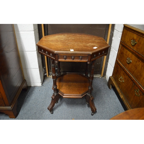 361 - A Victorian walnut octagonal shaped two-tier centre table.