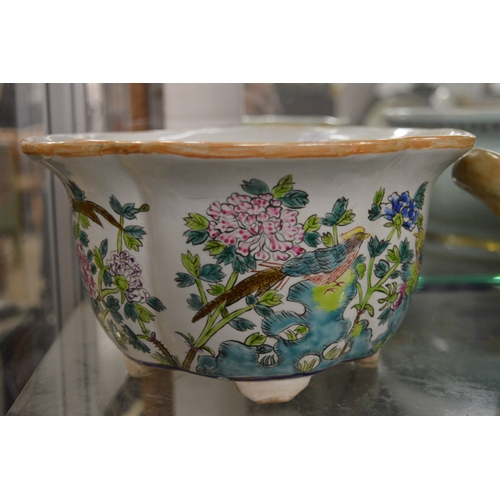 453 - A Chinese jardiniere painted with birds and flowers.