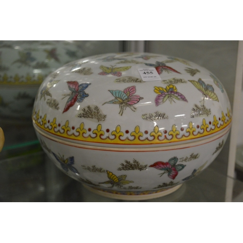 455 - A large Chinese circular bowl and cover decorated with butterflies.