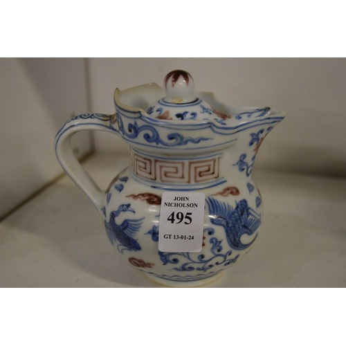 495 - A small Chinese ewer and cover.