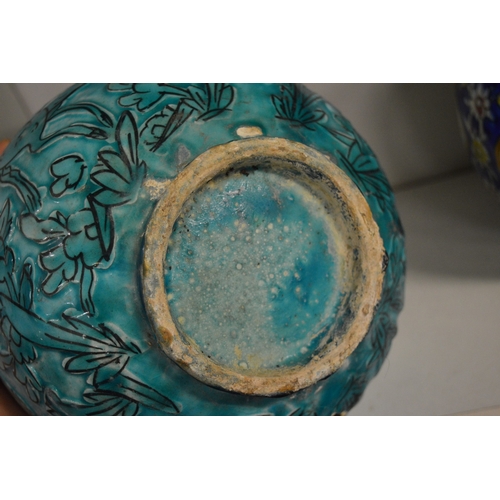 507 - Continental turquoise glazed pottery bowl with incised decoration depicting animals in a woodland se... 