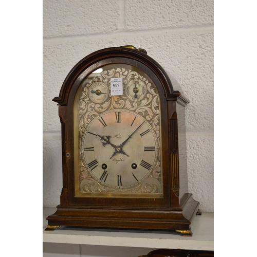 517 - A mahogany cased mantle clock with engraved silvered dial.