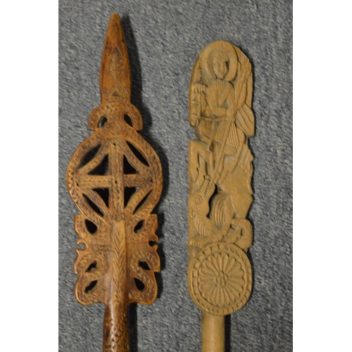 567 - Two carved wood staff's or pointers.