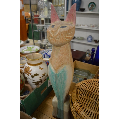 646 - Small group of games, wicker basket and a carved wood model of a cat.