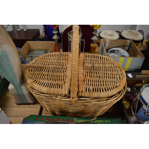 646 - Small group of games, wicker basket and a carved wood model of a cat.