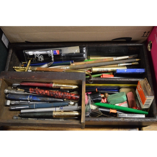 651 - An old wooden cutlery box containing numerous pens etc.