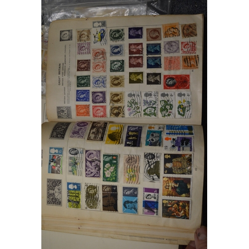 829 - A box of assorted stamp albums and loose stamps.