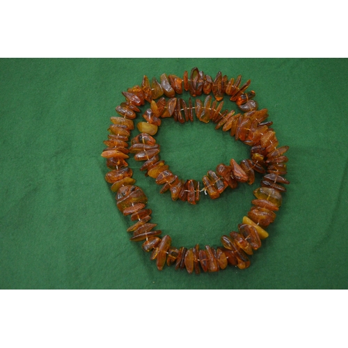 837 - Amber bead necklaces.