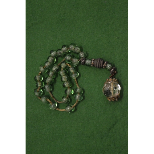 844 - A set of worry beads.