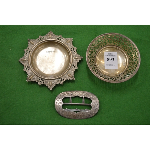 893 - Two small silver dishes and an engraved silver buckle.