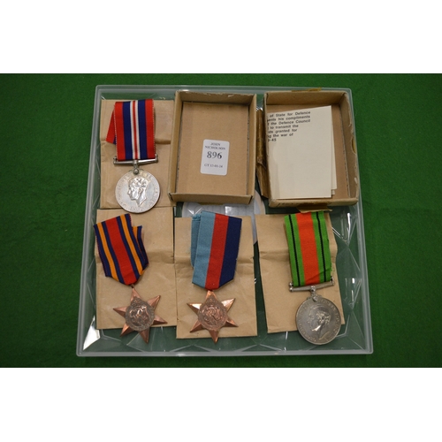 896 - A set of four World War II medals, unnamed.