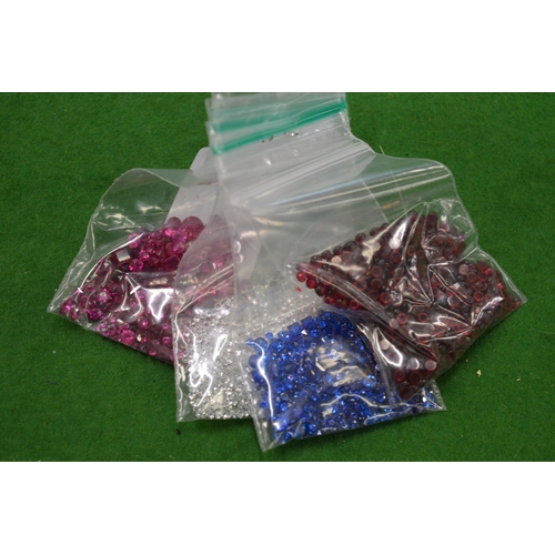 910 - Various bags of coloured spinels.