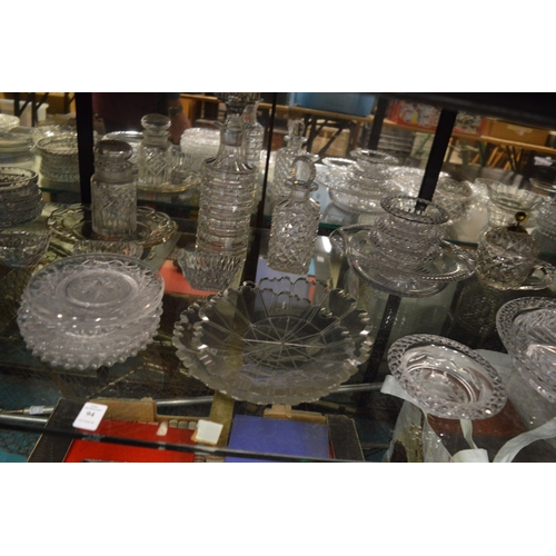 94 - A good collection of cut glassware to include ice plates, dishes, decanters etc.