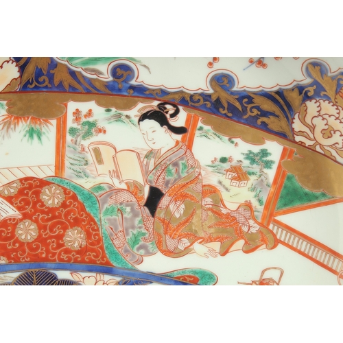 100 - A LARGE 19TH CENTURY JAPANESE IMARI PORCELAIN CHARGER, enamel painted with a scene of seated female ... 