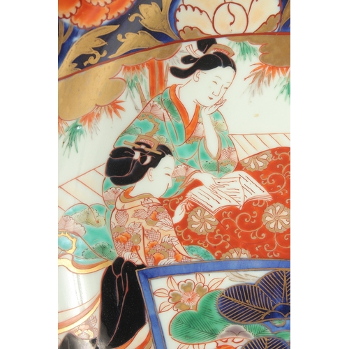 100 - A LARGE 19TH CENTURY JAPANESE IMARI PORCELAIN CHARGER, enamel painted with a scene of seated female ... 