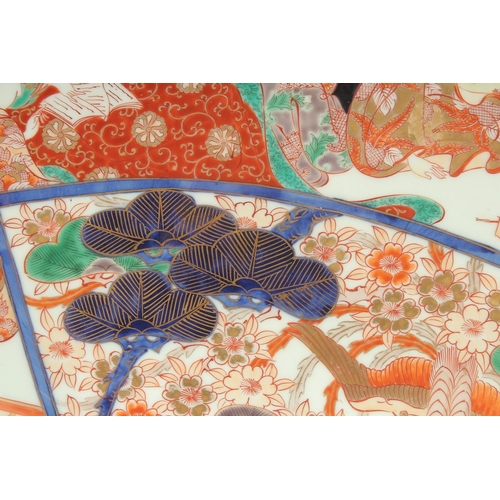 100 - A LARGE 19TH CENTURY JAPANESE IMARI PORCELAIN CHARGER, enamel painted with a scene of seated female ... 