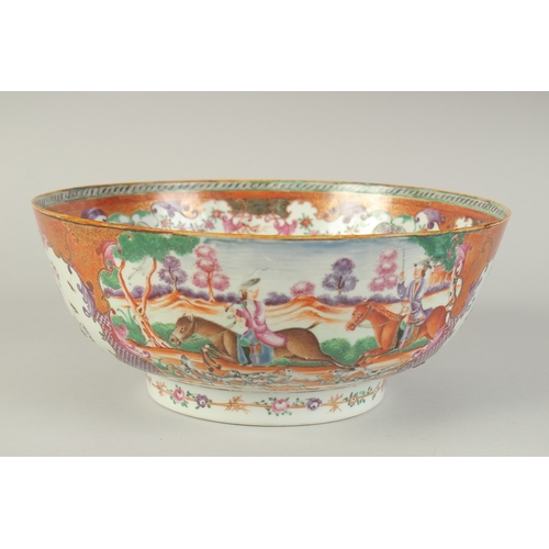 102 - A CHINESE EXPORT FAMILLE ROSE PORCELAIN HUNTING SCENE PUNCH BOWL, painted with European figures on h... 