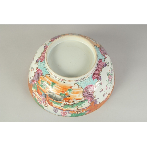 102 - A CHINESE EXPORT FAMILLE ROSE PORCELAIN HUNTING SCENE PUNCH BOWL, painted with European figures on h... 