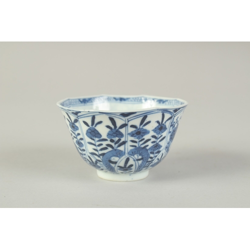 104 - A CHINESE BLUE AND WHITE PORCELAIN CUP, painted with flora, 8.5cm diameter.