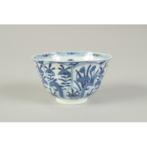 104 - A CHINESE BLUE AND WHITE PORCELAIN CUP, painted with flora, 8.5cm diameter.
