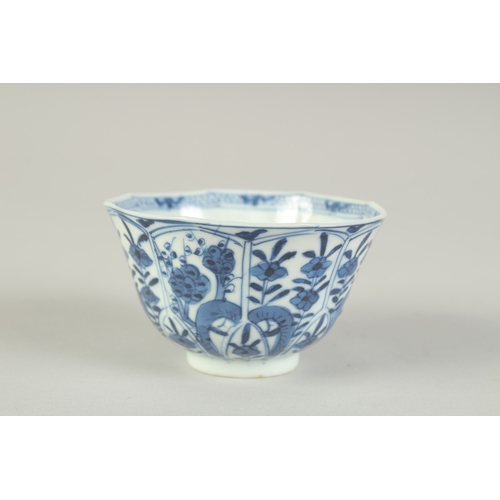 104 - A CHINESE BLUE AND WHITE PORCELAIN CUP, painted with flora, 8.5cm diameter.