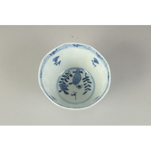 104 - A CHINESE BLUE AND WHITE PORCELAIN CUP, painted with flora, 8.5cm diameter.