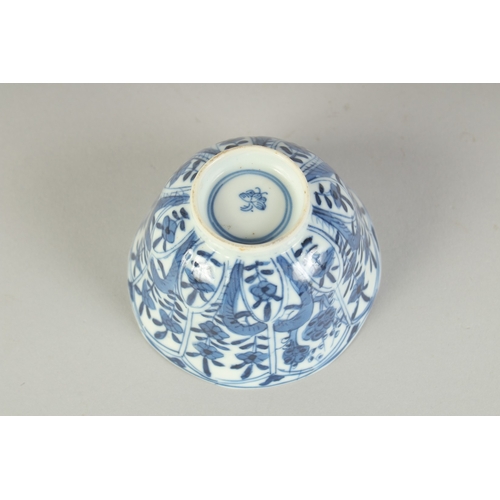 104 - A CHINESE BLUE AND WHITE PORCELAIN CUP, painted with flora, 8.5cm diameter.