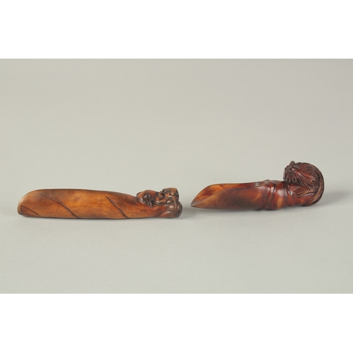 105 - TWO CARVED WOOD TEA SCOOPS, one carved with cockerel, the other carved with a goat, (2).