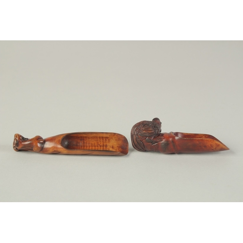 105 - TWO CARVED WOOD TEA SCOOPS, one carved with cockerel, the other carved with a goat, (2).