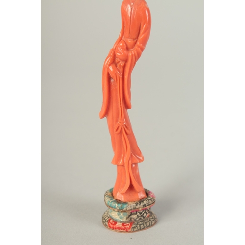 107 - A VERY FINE CHINESE CARVED CORAL FIGURE OF GUANYIN, on stand and in original fitted box with sliding... 