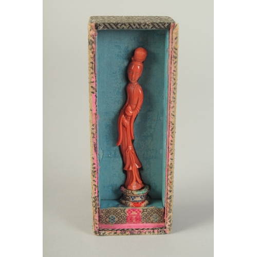 107 - A VERY FINE CHINESE CARVED CORAL FIGURE OF GUANYIN, on stand and in original fitted box with sliding... 