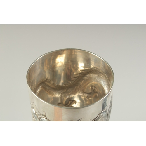 109 - A CHINESE SILVER FOOTED GOBLET CUP WITH EMBOSSED DRAGON, hallmark to base, inscribed to the foot, 23... 