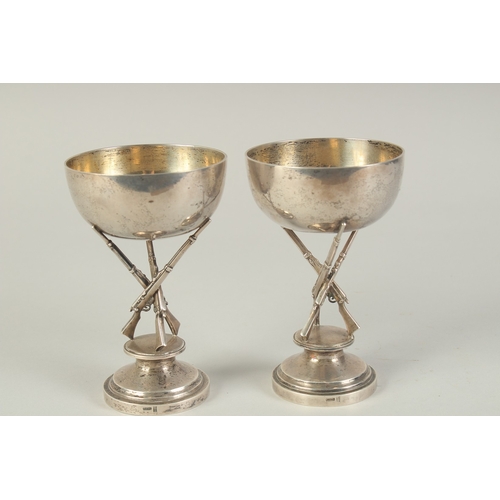 110 - A PAIR OF CHINESE SILVER HUNTING RIFLE FOOTED CUPS, hallmarks to the foot rim, 14.5cm high.