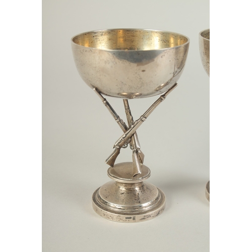 110 - A PAIR OF CHINESE SILVER HUNTING RIFLE FOOTED CUPS, hallmarks to the foot rim, 14.5cm high.