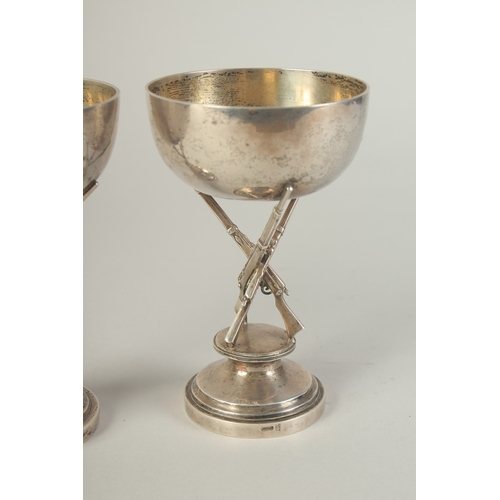 110 - A PAIR OF CHINESE SILVER HUNTING RIFLE FOOTED CUPS, hallmarks to the foot rim, 14.5cm high.