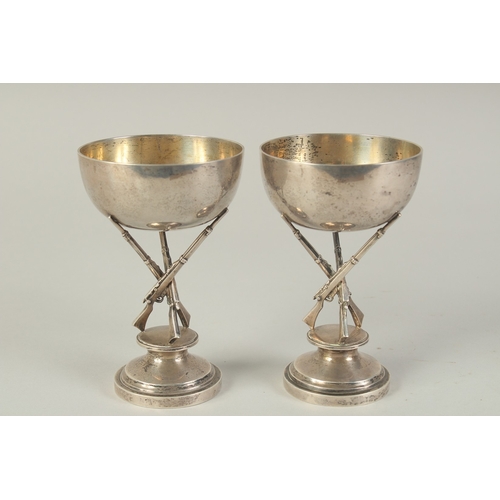 110 - A PAIR OF CHINESE SILVER HUNTING RIFLE FOOTED CUPS, hallmarks to the foot rim, 14.5cm high.