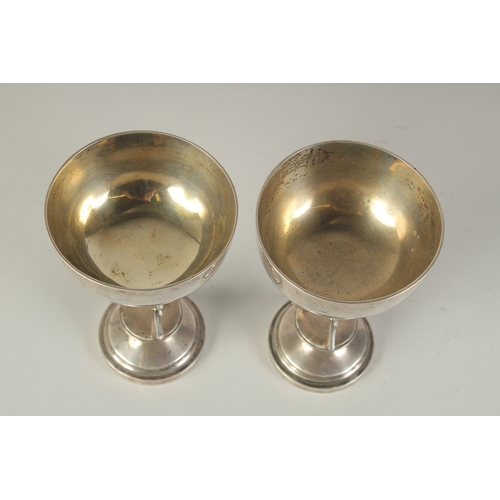 110 - A PAIR OF CHINESE SILVER HUNTING RIFLE FOOTED CUPS, hallmarks to the foot rim, 14.5cm high.