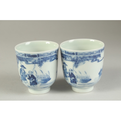 116 - A PAIR OF CHINESE BLUE AND WHITE PORCELAIN CUPS, painted with a fishing scene, the bases with four-c... 