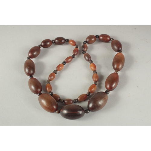 50 - A GRADUATED RHINO HORN BEAD NECKLACE.
